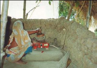 Woman Cooking With Biogas